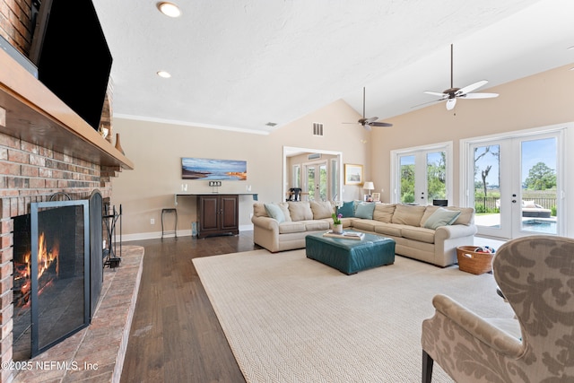 24544 Deer Trace Dr, Ponte Vedra Beach, FL 32082 - living room featuring dark wood-style flooring, a ceiling fan, a fireplace, baseboards, and vaulted ceiling