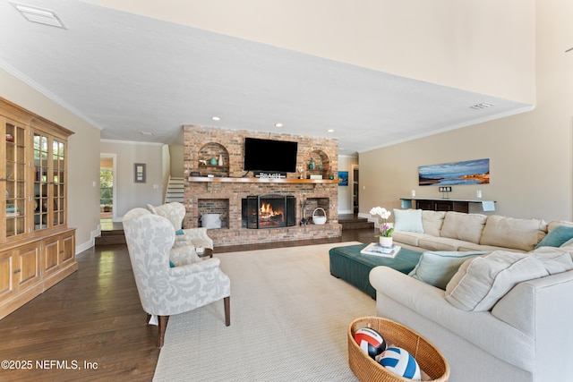 24544 Deer Trace Dr, Ponte Vedra Beach, FL 32082 - living room featuring dark wood-style floors, ornamental molding, a brick fireplace, baseboards, and recessed lighting