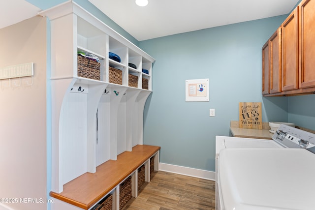 24544 Deer Trace Dr, Ponte Vedra Beach, FL 32082 - laundry area with washer and clothes dryer, light wood-style flooring, cabinet space, baseboards, and recessed lighting