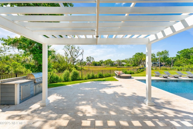 24544 Deer Trace Dr, Ponte Vedra Beach, FL 32082 - view of patio / terrace featuring a grill, area for grilling, a pergola, and view of scattered trees