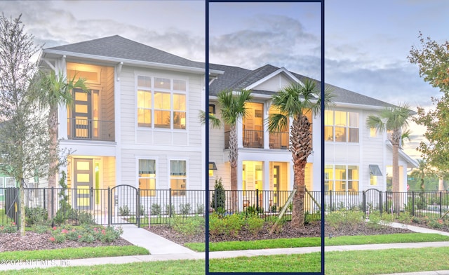 townhome / multi-family property featuring a fenced front yard