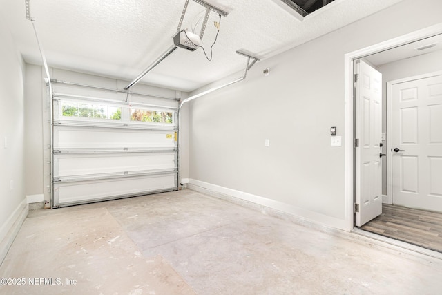 409 Willow Branch Ave, Jacksonville, FL 32254 - garage featuring baseboards and a garage door opener