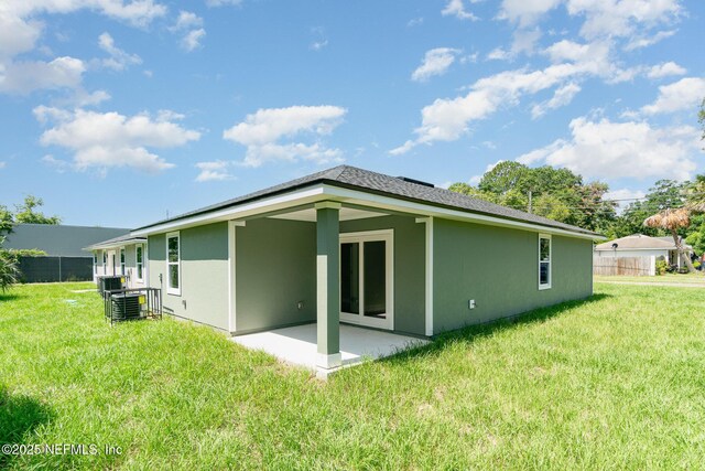 409 Willow Branch Ave, Jacksonville, FL 32254 - back of property featuring a patio area and stucco siding