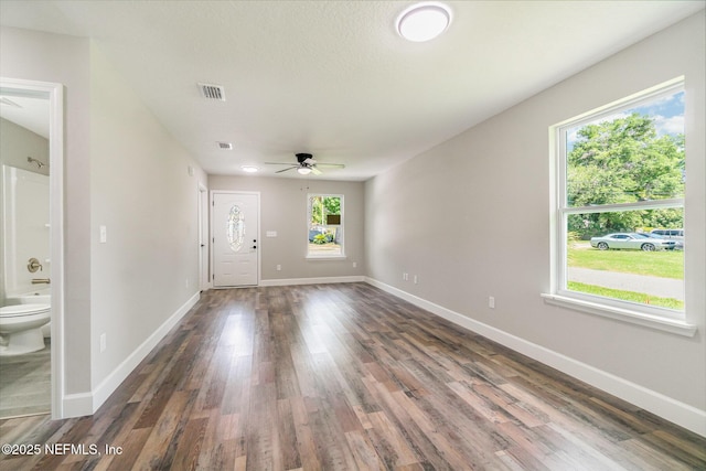 409 Willow Branch Ave, Jacksonville, FL 32254 - unfurnished living room with a ceiling fan and dark wood-style flooring