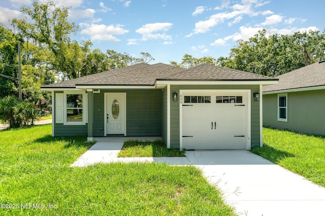 409 Willow Branch Ave, Jacksonville, FL 32254 - view of front facade with a garage, a front lawn, driveway, and a shingled roof