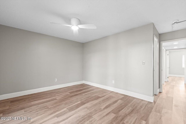 7142 Cypress Cove Rd Unit 39, Jacksonville, FL 32244 - unfurnished room featuring light wood finished floors, a ceiling fan, and baseboards