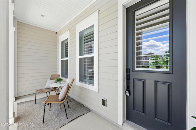 doorway to property featuring covered porch