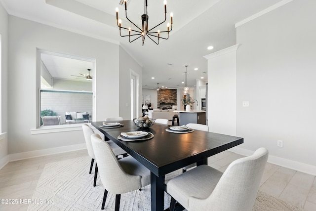 dining room with a ceiling fan, a chandelier, recessed lighting, and baseboards