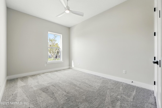 spare room with carpet flooring, ceiling fan, and baseboards