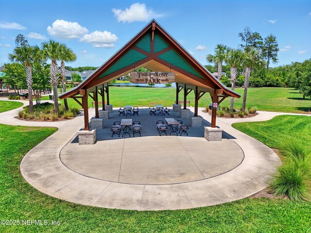 view of property's community featuring a gazebo and a lawn
