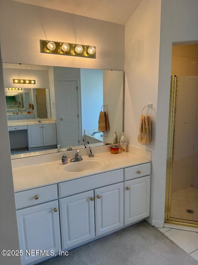 bathroom featuring a stall shower and vanity