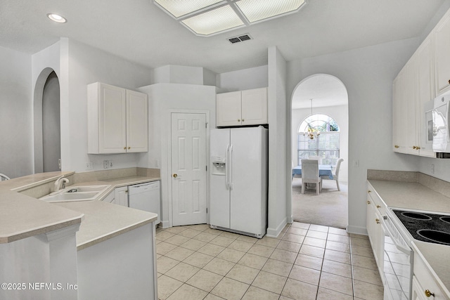 809 Lotus Ln N, Fruit Cove, FL 32259 - kitchen featuring white appliances, arched walkways, a sink, white cabinets, and recessed lighting
