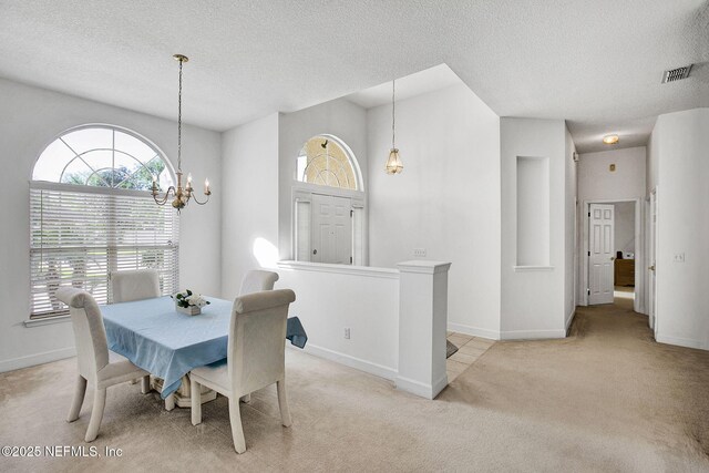809 Lotus Ln N, Fruit Cove, FL 32259 - dining area featuring light colored carpet, a textured ceiling, baseboards, and a chandelier