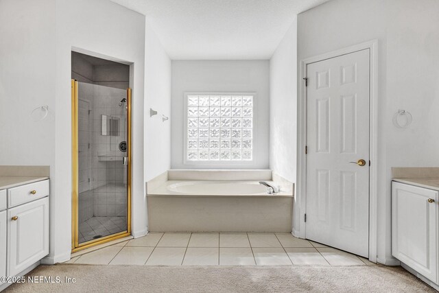 809 Lotus Ln N, Fruit Cove, FL 32259 - full bathroom with vanity, a stall shower, tile patterned flooring, and a bath