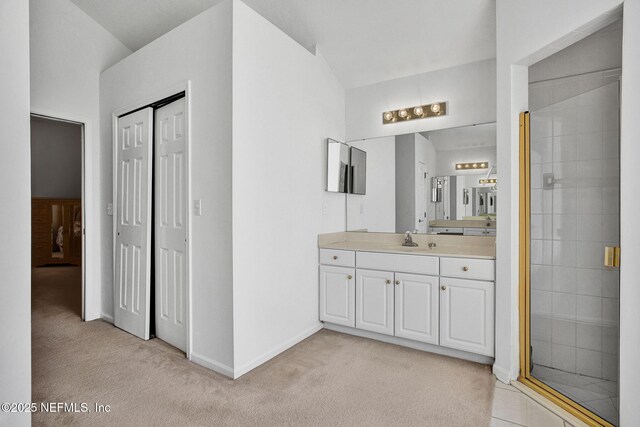 809 Lotus Ln N, Fruit Cove, FL 32259 - full bath featuring carpet flooring, a stall shower, baseboards, vanity, and vaulted ceiling