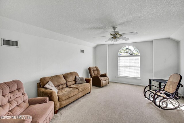 809 Lotus Ln N, Fruit Cove, FL 32259 - living area featuring vaulted ceiling, light colored carpet, a textured ceiling, ceiling fan, and baseboards
