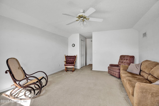 809 Lotus Ln N, Fruit Cove, FL 32259 - living area with light colored carpet, vaulted ceiling, a ceiling fan, baseboards, and a textured ceiling