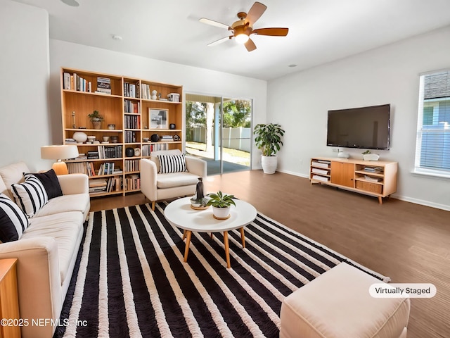 3020 Southbank Cir, Green Cove Springs, FL 32043 - living area featuring wood finished floors, ceiling fan, and baseboards