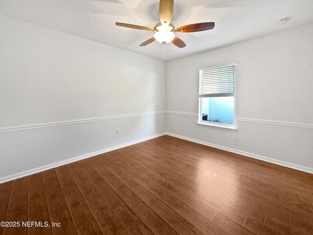 3020 Southbank Cir, Green Cove Springs, FL 32043 - empty room with dark wood-type flooring, a ceiling fan, and baseboards
