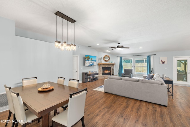 1770 High Brook Ct, Jacksonville, FL 32225 - dining space featuring a lit fireplace, ceiling fan, wood finished floors, and recessed lighting