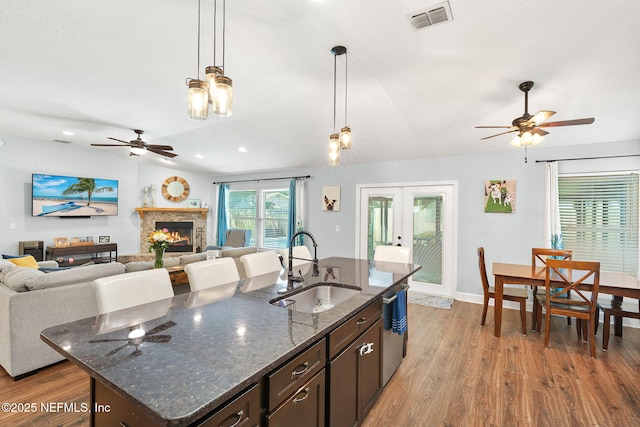 1770 High Brook Ct, Jacksonville, FL 32225 - kitchen featuring a sink, ceiling fan, wood finished floors, stainless steel dishwasher, and french doors