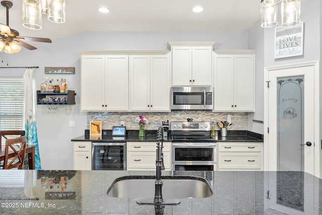 1770 High Brook Ct, Jacksonville, FL 32225 - kitchen with appliances with stainless steel finishes, beverage cooler, a sink, a ceiling fan, and lofted ceiling