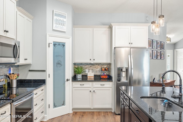 1770 High Brook Ct, Jacksonville, FL 32225 - kitchen featuring appliances with stainless steel finishes, a sink, tasteful backsplash, and dark stone counters