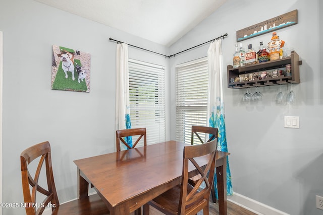 1770 High Brook Ct, Jacksonville, FL 32225 - dining room featuring vaulted ceiling, baseboards, a dry bar, and wood finished floors