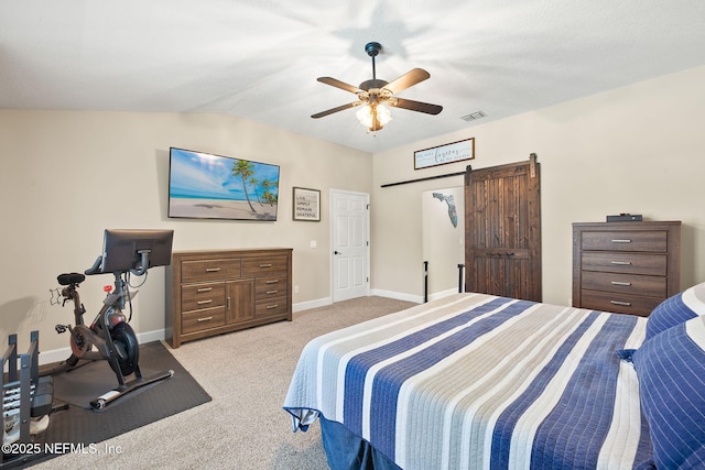 1770 High Brook Ct, Jacksonville, FL 32225 - bedroom featuring a barn door, light colored carpet, baseboards, vaulted ceiling, and a ceiling fan