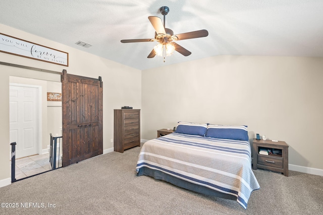 1770 High Brook Ct, Jacksonville, FL 32225 - bedroom with carpet, vaulted ceiling, baseboards, a barn door, and a ceiling fan