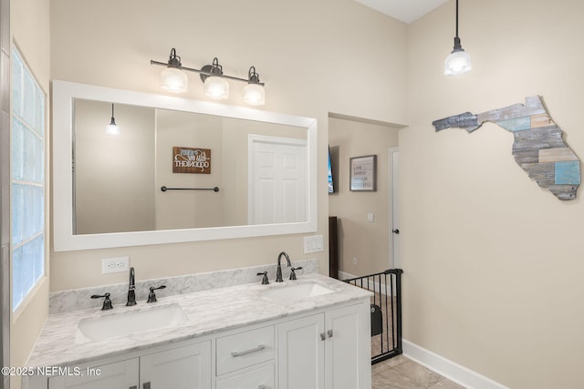 1770 High Brook Ct, Jacksonville, FL 32225 - bathroom featuring double vanity, baseboards, and tile patterned flooring