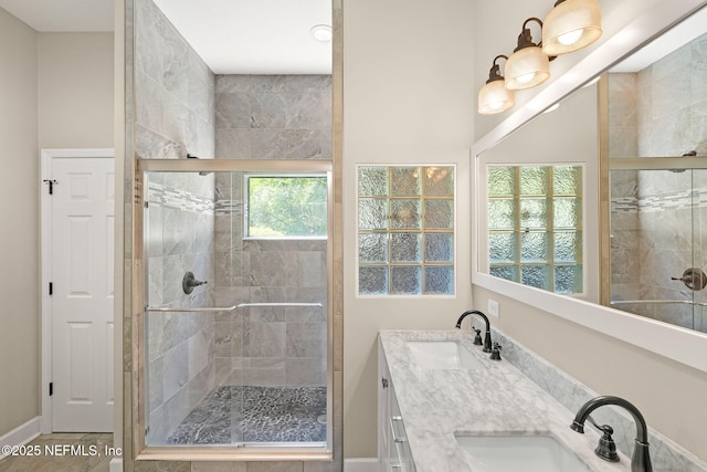 1770 High Brook Ct, Jacksonville, FL 32225 - bathroom featuring a stall shower, double vanity, and baseboards