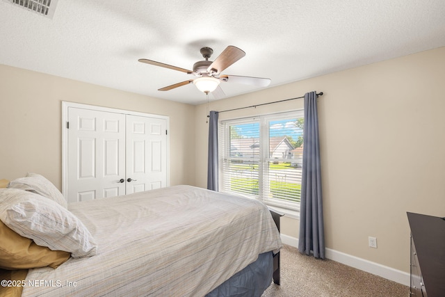 1770 High Brook Ct, Jacksonville, FL 32225 - bedroom with light colored carpet, a closet, baseboards, ceiling fan, and a textured ceiling