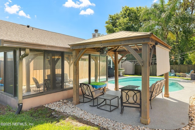 1770 High Brook Ct, Jacksonville, FL 32225 - view of pool with a sunroom, a fenced backyard, a patio area, a storage shed, and a gazebo