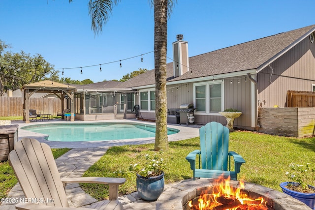 1770 High Brook Ct, Jacksonville, FL 32225 - view of swimming pool featuring area for grilling, an outdoor fire pit, a patio, a sunroom, and a gazebo