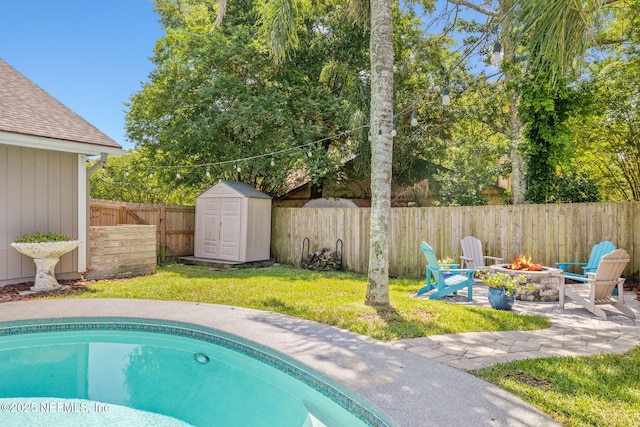 1770 High Brook Ct, Jacksonville, FL 32225 - view of pool featuring a fire pit, a storage shed, an outbuilding, and a patio