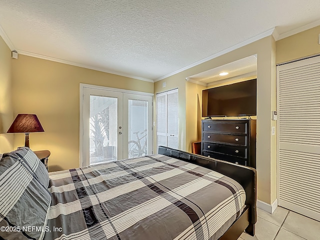 bedroom featuring french doors, ornamental molding, access to exterior, light tile patterned floors, and baseboards