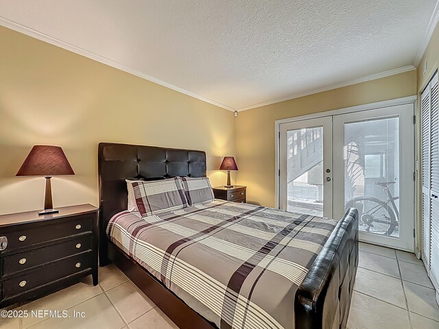 bedroom with access to outside, light tile patterned flooring, french doors, ornamental molding, and a textured ceiling