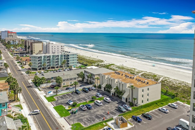 aerial view of expansive beach and apartment complex / building