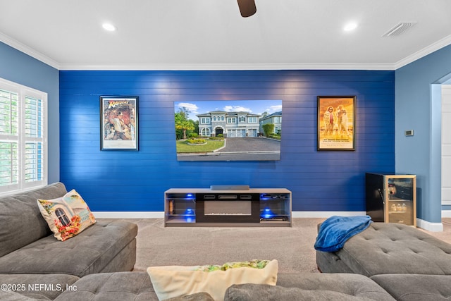 135 Tate Ln, Saint Johns, FL 32259 - carpeted living area featuring crown molding, beverage cooler, recessed lighting, baseboards, and wood walls