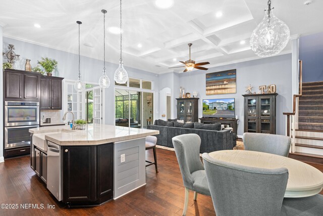 135 Tate Ln, Saint Johns, FL 32259 - kitchen with recessed lighting, a ceiling fan, decorative light fixtures, a center island with sink, and coffered ceiling