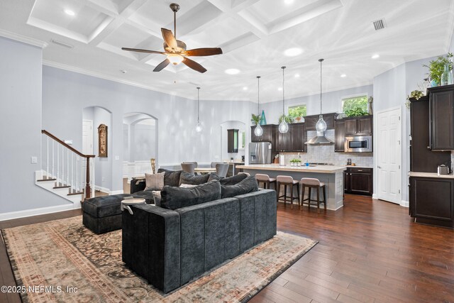 135 Tate Ln, Saint Johns, FL 32259 - living room with arched walkways, coffered ceiling, a ceiling fan, dark wood-type flooring, and recessed lighting