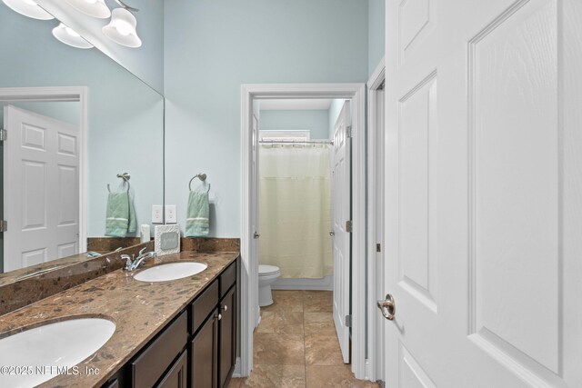 135 Tate Ln, Saint Johns, FL 32259 - bathroom with toilet, double vanity, and a shower with shower curtain