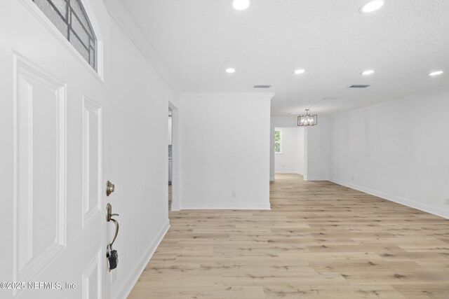 7420 Mayapple Rd, Jacksonville, FL 32211 - empty room featuring recessed lighting, a chandelier, ornamental molding, baseboards, and light wood finished floors