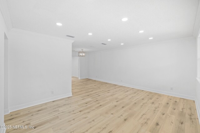 7420 Mayapple Rd, Jacksonville, FL 32211 - empty room featuring crown molding, a chandelier, recessed lighting, baseboards, and light wood-style flooring