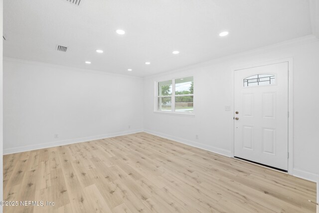 7420 Mayapple Rd, Jacksonville, FL 32211 - foyer with crown molding, recessed lighting, light wood-style flooring, and baseboards