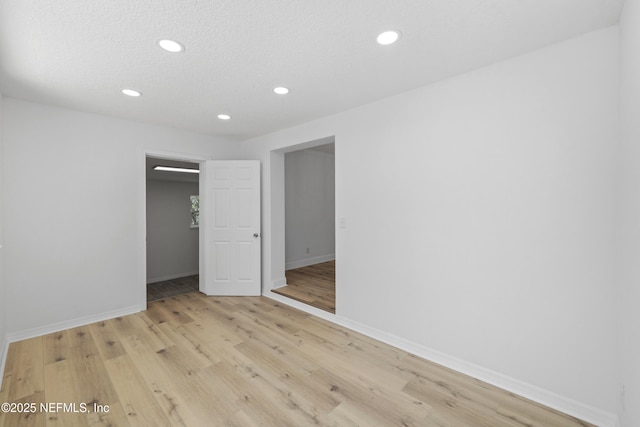 7420 Mayapple Rd, Jacksonville, FL 32211 - unfurnished bedroom featuring recessed lighting, baseboards, light wood finished floors, and a closet