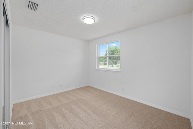 7420 Mayapple Rd, Jacksonville, FL 32211 - unfurnished room featuring carpet floors, baseboards, and a textured ceiling