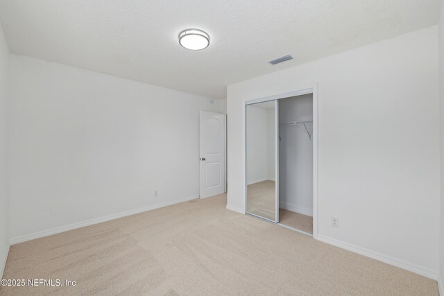 7420 Mayapple Rd, Jacksonville, FL 32211 - unfurnished bedroom with carpet floors, a closet, and baseboards