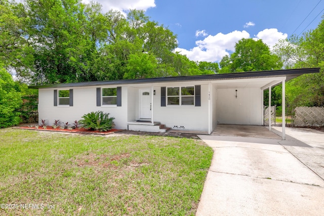 7420 Mayapple Rd, Jacksonville, FL 32211 - single story home featuring concrete driveway and an attached carport